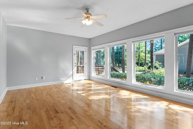 183 Baker Cir W, End, NC 27376 - unfurnished room with healthy amount of natural light, ceiling fan, and wood finished floors