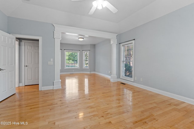 183 Baker Cir W, End, NC 27376 - empty room featuring ceiling fan, light wood-style flooring, and ornate columns