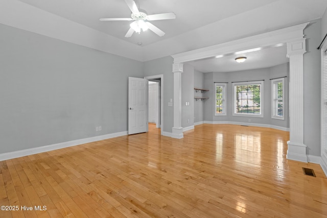 183 Baker Cir W, End, NC 27376 - unfurnished living room featuring ornate columns, light wood-type flooring, and a ceiling fan