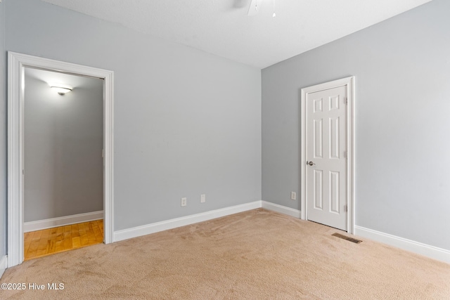 183 Baker Cir W, End, NC 27376 - unfurnished bedroom with carpet and baseboards