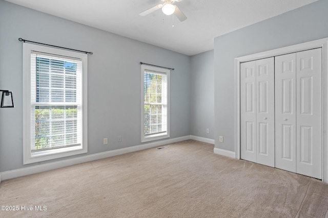 183 Baker Cir W, End, NC 27376 - unfurnished bedroom featuring carpet, a closet, and ceiling fan