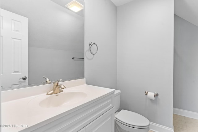 183 Baker Cir W, End, NC 27376 - half bathroom featuring vanity, tile patterned flooring, and lofted ceiling