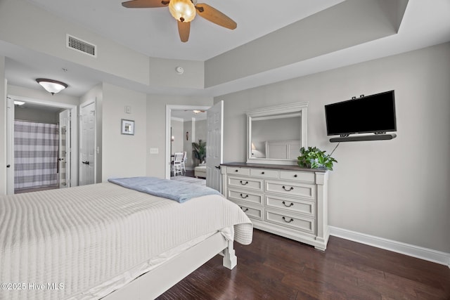 219 Sky Sail Blvd, New Bern, NC 28560 - bedroom with dark wood finished floors, ceiling fan, and a tray ceiling