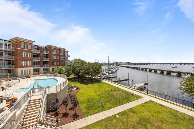 219 Sky Sail Blvd, New Bern, NC 28560 - community pool featuring a water view, a boat dock, and a lawn