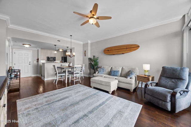 219 Sky Sail Blvd, New Bern, NC 28560 - living area with ceiling fan, dark wood finished floors, ornamental molding, and a chandelier