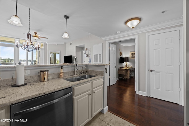 219 Sky Sail Blvd, New Bern, NC 28560 - kitchen with dishwasher, light stone counters, hanging light fixtures, white cabinetry, and a chandelier