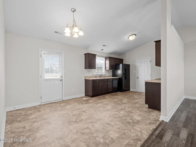 404 Bristol Ln, Hubert, NC 28539 - kitchen featuring black appliances, dark brown cabinetry, light countertops, a chandelier, and decorative light fixtures