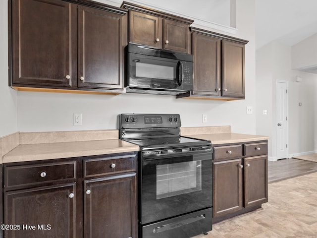 404 Bristol Ln, Hubert, NC 28539 - kitchen featuring black appliances, dark brown cabinets, and light countertops