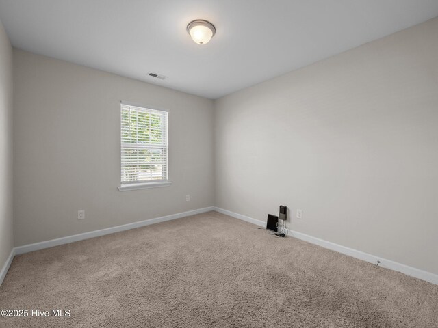 404 Bristol Ln, Hubert, NC 28539 - carpeted empty room with baseboards