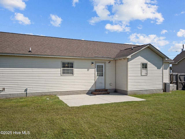 404 Bristol Ln, Hubert, NC 28539 - back of property with a yard, a patio area, and a shingled roof
