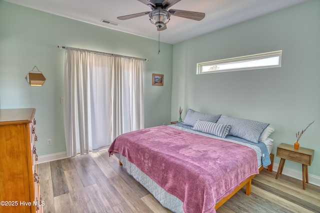 314 Spencer Farlow Dr Unit 2, Carolina Beach, NC 28428 - bedroom with wood finished floors and ceiling fan