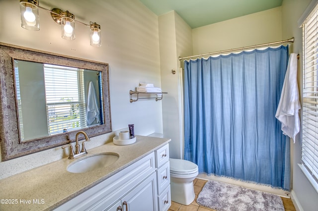 314 Spencer Farlow Dr Unit 2, Carolina Beach, NC 28428 - bathroom featuring healthy amount of natural light, vanity, tile patterned floors, and a shower with shower curtain