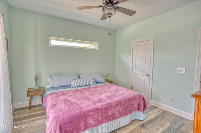 314 Spencer Farlow Dr Unit 2, Carolina Beach, NC 28428 - bedroom featuring wood finished floors and a ceiling fan