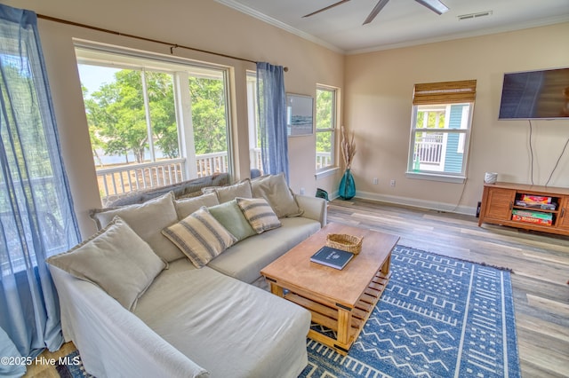 314 Spencer Farlow Dr Unit 2, Carolina Beach, NC 28428 - living room with ornamental molding, wood finished floors, and a ceiling fan