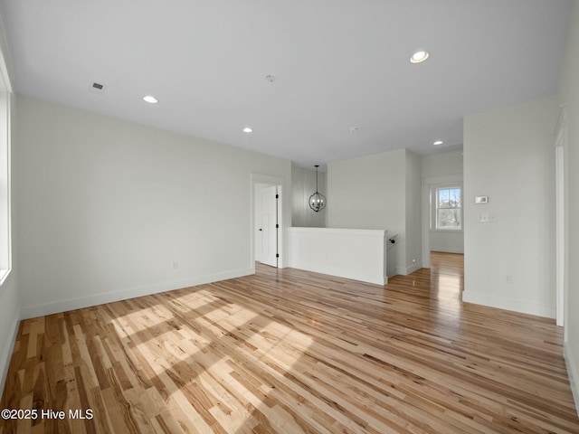 202 Topsail Watch Dr, Hampstead, NC 28443 - unfurnished living room with light wood finished floors and recessed lighting