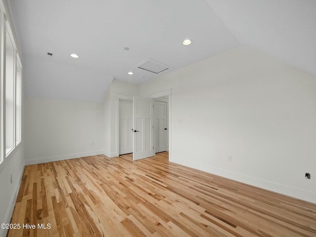 202 Topsail Watch Dr, Hampstead, NC 28443 - additional living space with attic access, vaulted ceiling, light wood-style floors, and recessed lighting