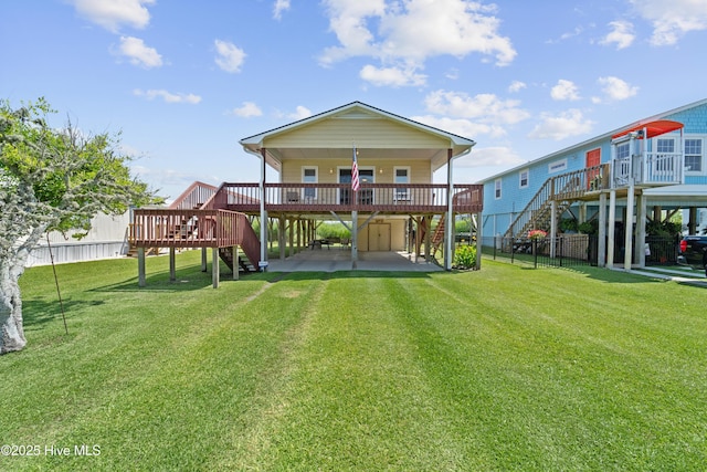 9010 W 9th St, Surf City, NC 28445 - rear view of house with stairs and a deck