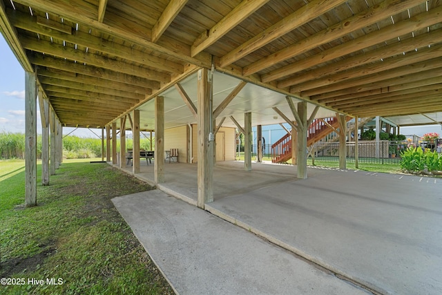 9010 W 9th St, Surf City, NC 28445 - view of patio / terrace featuring a carport and stairway