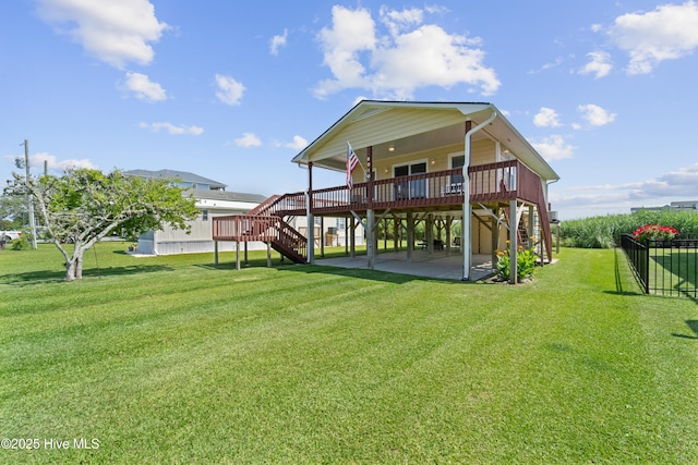 9010 W 9th St, Surf City, NC 28445 - back of house featuring stairway, a patio area, a wooden deck, and a carport