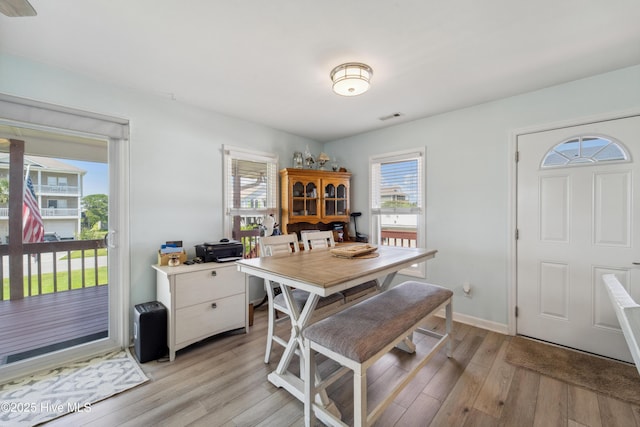 9010 W 9th St, Surf City, NC 28445 - dining room with plenty of natural light, light wood-style floors, and a desk