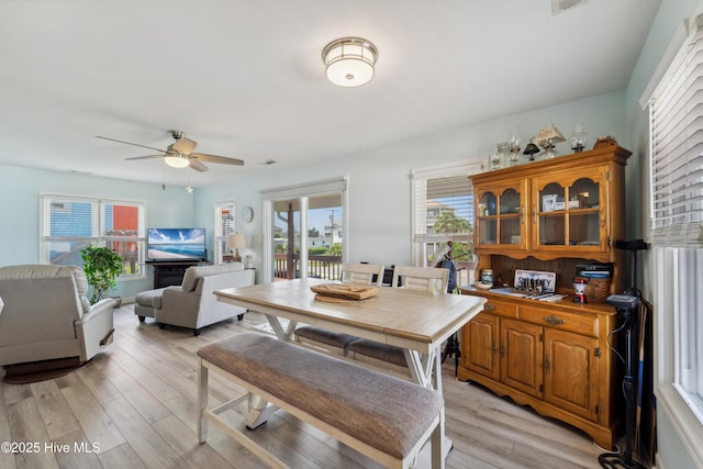 9010 W 9th St, Surf City, NC 28445 - dining room with ceiling fan and light wood-type flooring