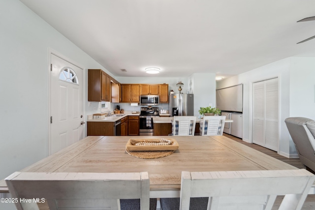 9010 W 9th St, Surf City, NC 28445 - dining space featuring light wood-style floors and baseboards