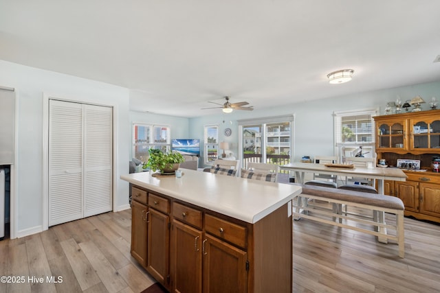 9010 W 9th St, Surf City, NC 28445 - kitchen with light wood-type flooring, a ceiling fan, plenty of natural light, and light countertops