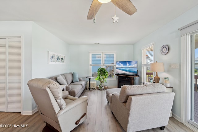 9010 W 9th St, Surf City, NC 28445 - living room with wood finished floors and a ceiling fan