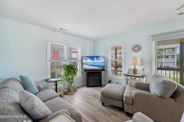 9010 W 9th St, Surf City, NC 28445 - living room with wood finished floors and baseboards