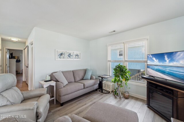 9010 W 9th St, Surf City, NC 28445 - living room with light wood finished floors and baseboards