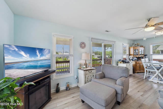 9010 W 9th St, Surf City, NC 28445 - living room with light wood finished floors and a ceiling fan