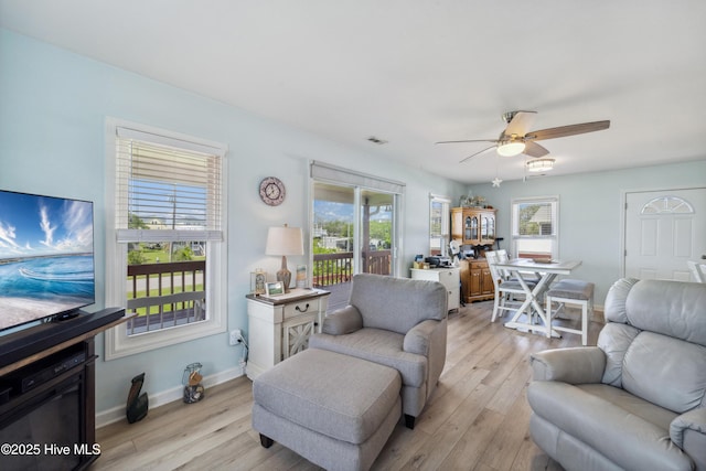 9010 W 9th St, Surf City, NC 28445 - living room with plenty of natural light, ceiling fan, and light wood finished floors