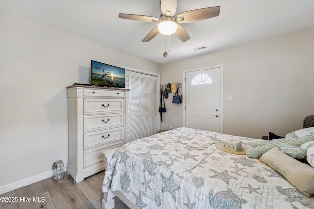 9010 W 9th St, Surf City, NC 28445 - bedroom with light wood finished floors, a closet, and a ceiling fan