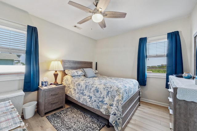 9010 W 9th St, Surf City, NC 28445 - bedroom with wood finished floors and ceiling fan