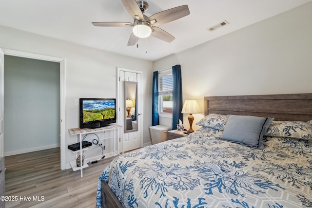9010 W 9th St, Surf City, NC 28445 - bedroom featuring wood finished floors and ceiling fan