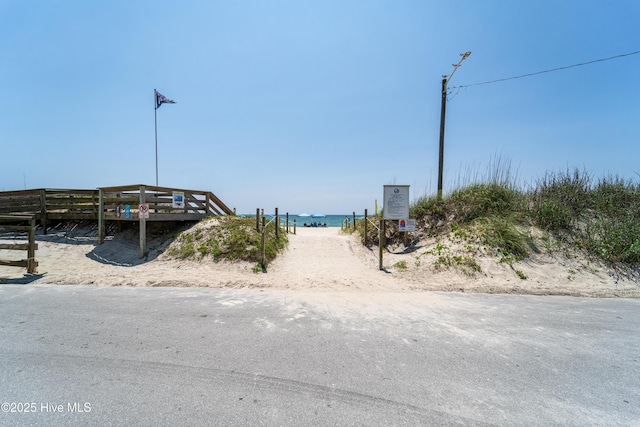 9010 W 9th St, Surf City, NC 28445 - view of asphalt road with view of water and beach