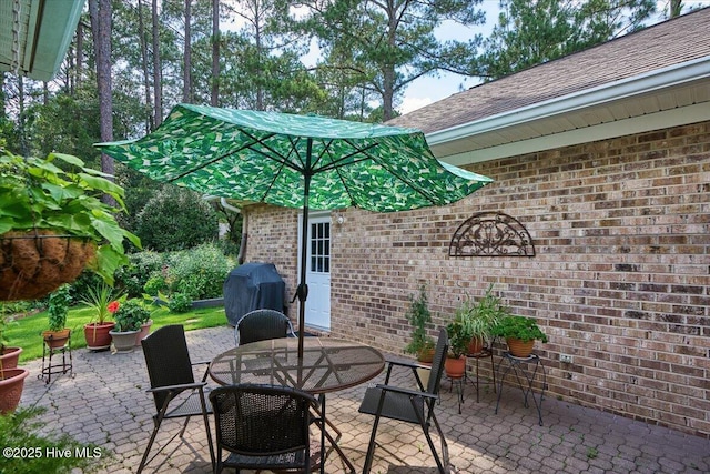 1 Pine Crest Dr, Whispering Pines, NC 28327 - view of patio / terrace featuring grilling area and outdoor dining area