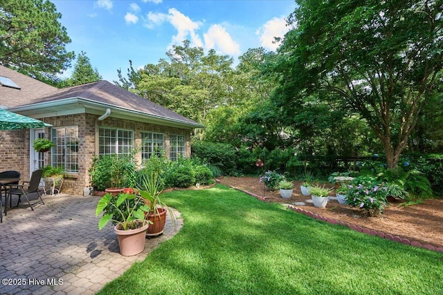 1 Pine Crest Dr, Whispering Pines, NC 28327 - view of green lawn with a patio area