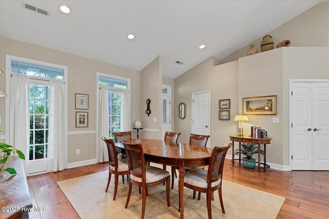 1 Pine Crest Dr, Whispering Pines, NC 28327 - dining room with light wood-style floors, lofted ceiling, and recessed lighting