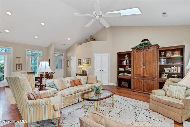 1 Pine Crest Dr, Whispering Pines, NC 28327 - living area with light wood-style flooring, ceiling fan, recessed lighting, a skylight, and high vaulted ceiling