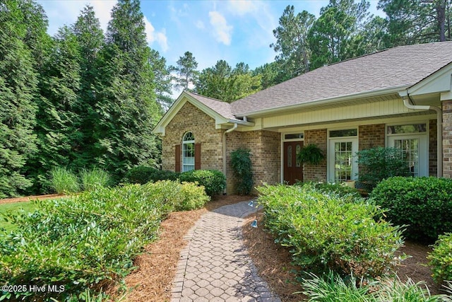 1 Pine Crest Dr, Whispering Pines, NC 28327 - view of front of house featuring brick siding and a shingled roof