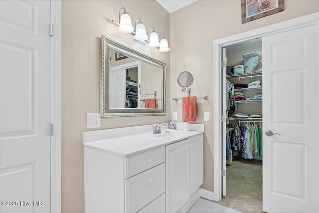 1 Pine Crest Dr, Whispering Pines, NC 28327 - bathroom featuring vanity and a walk in closet