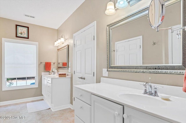 1 Pine Crest Dr, Whispering Pines, NC 28327 - bathroom featuring two vanities and tile patterned flooring