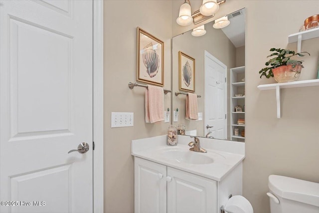 1 Pine Crest Dr, Whispering Pines, NC 28327 - half bath featuring vanity and toilet