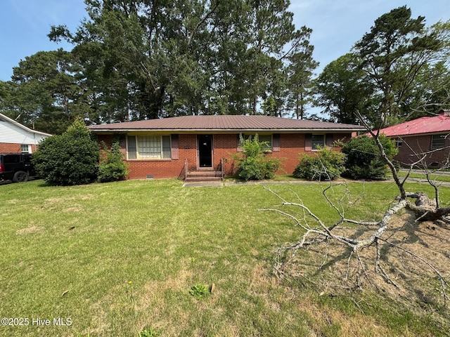 411 Lafayette St, Clinton, NC 28328 - ranch-style home with brick siding, a metal roof, entry steps, and a front lawn