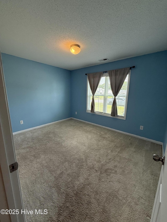 102 Harmony Way, Richlands, NC 28574 - empty room with a textured ceiling and carpet