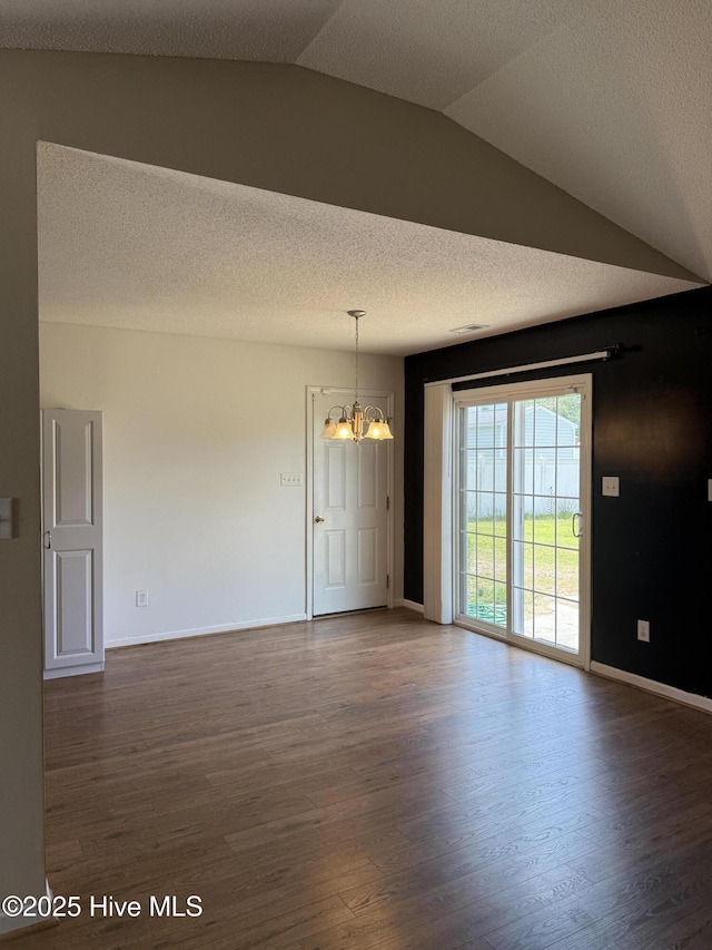 102 Harmony Way, Richlands, NC 28574 - unfurnished dining area with a chandelier, dark wood-style flooring, and vaulted ceiling