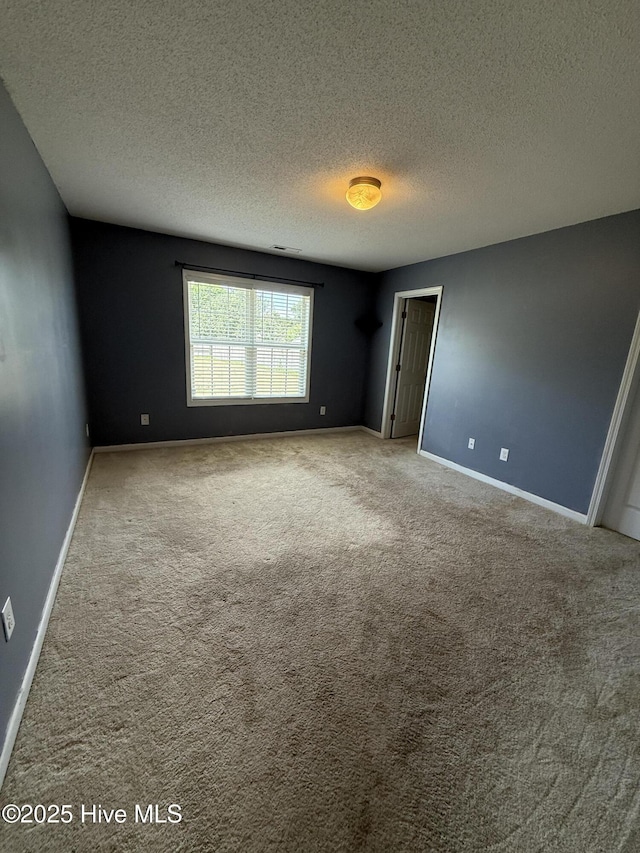 102 Harmony Way, Richlands, NC 28574 - carpeted empty room with a textured ceiling and baseboards