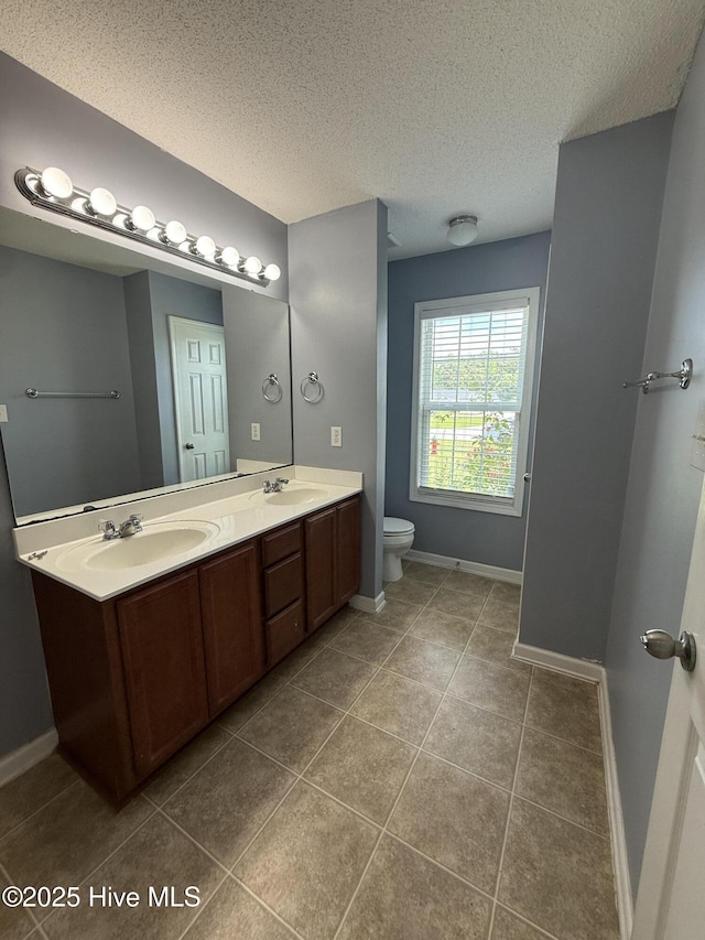 102 Harmony Way, Richlands, NC 28574 - full bathroom with double vanity, tile patterned flooring, and a textured ceiling