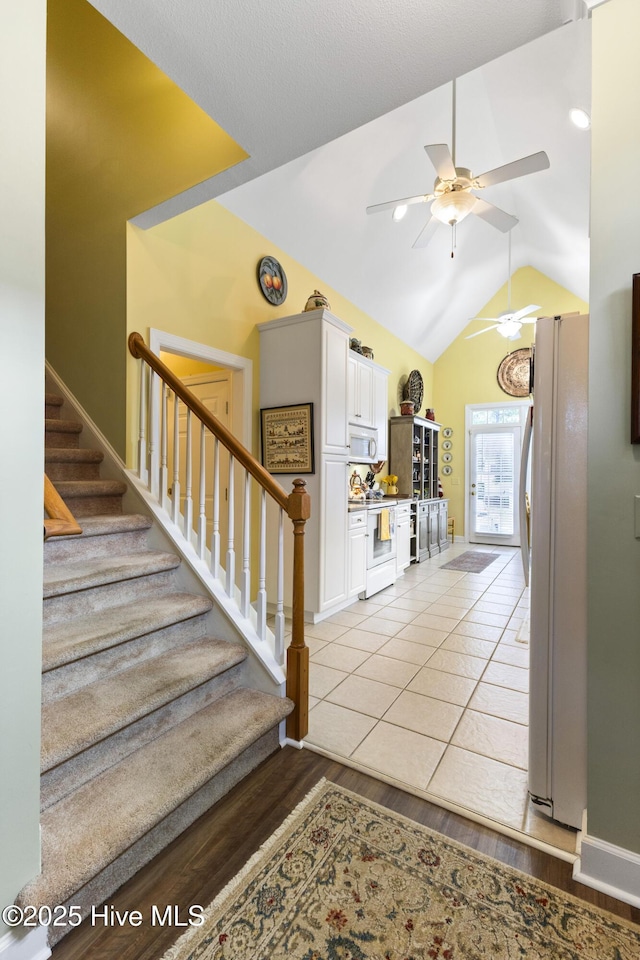1178 Eastwood Landing Way, Sunset Beach, NC 28468 - foyer featuring stairs, a ceiling fan, light wood-style flooring, and lofted ceiling